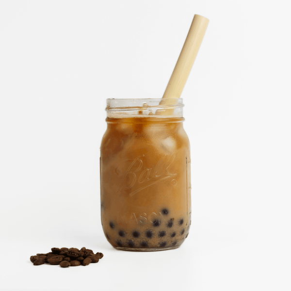 HAY! Straws boba straw with a 45 degree angle, a compostable boba straw in an iced coffee flavored boba drink