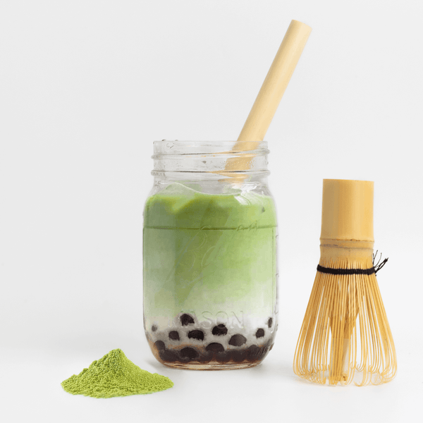 A biodegradable boba straw by HAY! Straws in an iced matcha drink, a wide natural straw for bubble tea drinks